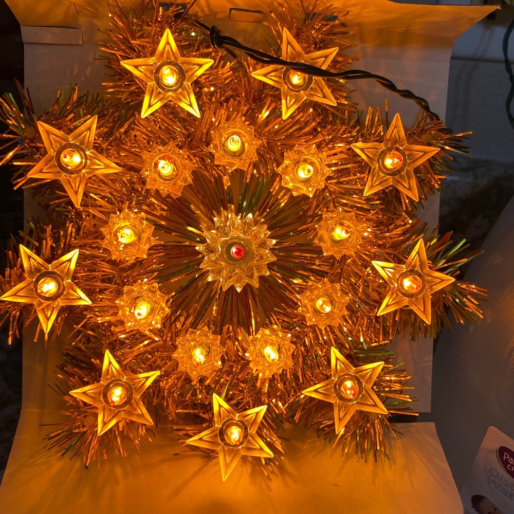 Vintage lighted star tree topper.  19 lights